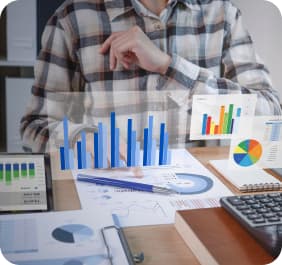 Person pointing at bar chart